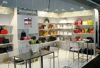Adrienne Vittadini Handbags booth with hardwall and shelving by Manny Stone Decorators